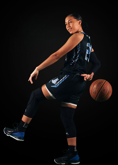 A Girl With a Basketball in a Black Background