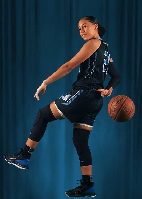 A Girl With a Basketball in a Blue Background